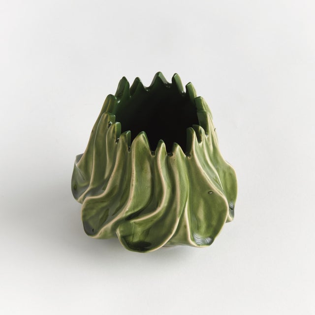With a sculptural, luster effect, this unusual form of a vase truly captivates. Made of clay & finished with a highgloss...