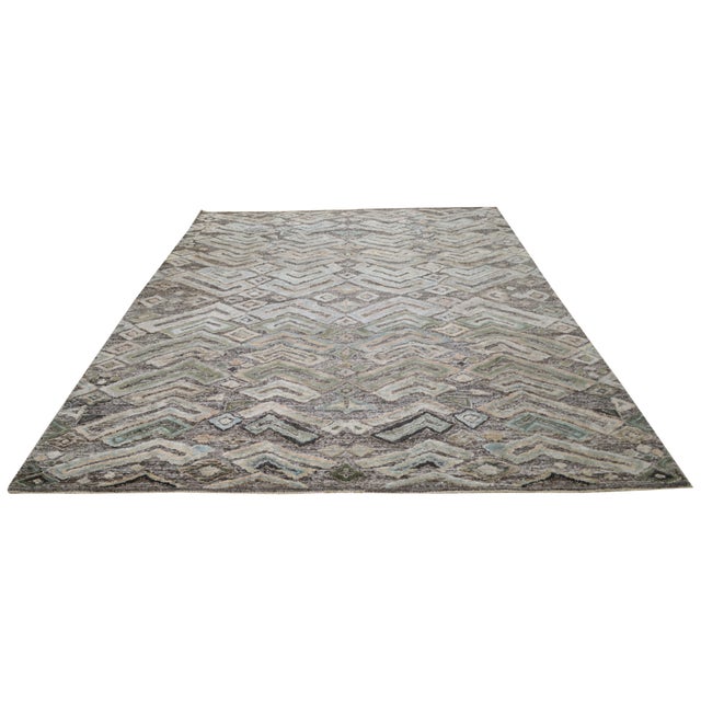 Hand-knotted with care using traditional rug making techniques, this wool rug blends timeless craftsmanship with a modern...