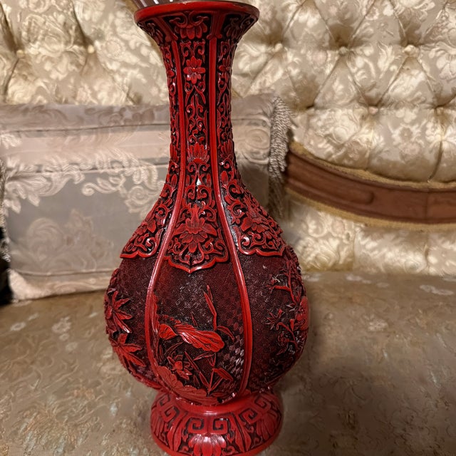 Beautiful 12-inch Chinese-style decorative vase featuring an intricate red carved design with traditional floral and...