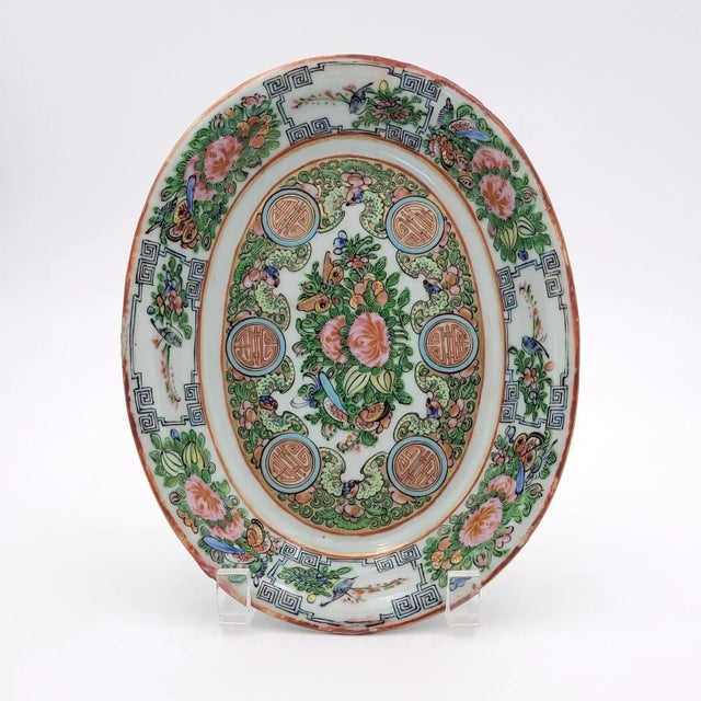 A famille rose oval low bowl, China circa 1910. This is decorated with flowers and butterflies.