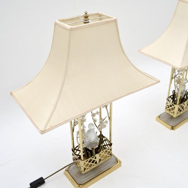An absolutely stunning pair of vintage French brass and opaline glass table lamps by Maison Bagues, dating from around the...