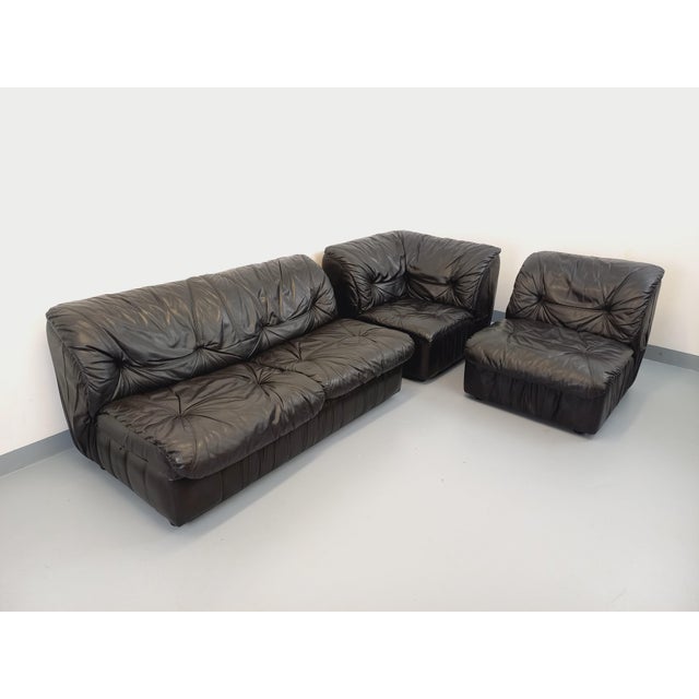 Vintage 1970s corner sofa in black leather, superb design in the style of De Sede, Cinna, or Ligne Roset, composed of...