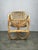Sculptural rattan lounge armchair designed by tito agnoli in italy during the 1950s, representing the sophisticated...