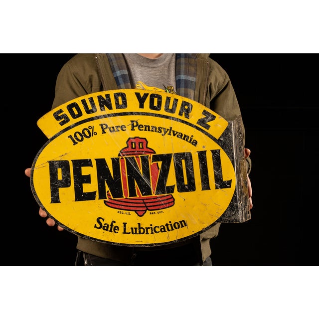 1948; Pennzoil Company - Houston, TX Vintage flagned Pennzoil logo sign. This piece features the iconic oval Pennzoil logo...