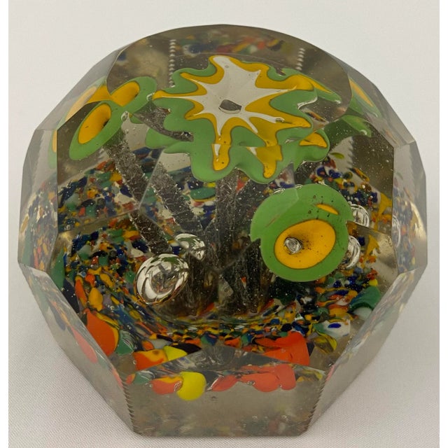 A stunning Saint Louis paperweight dating back to the late 19th Century with roses and flowers that will spark your...