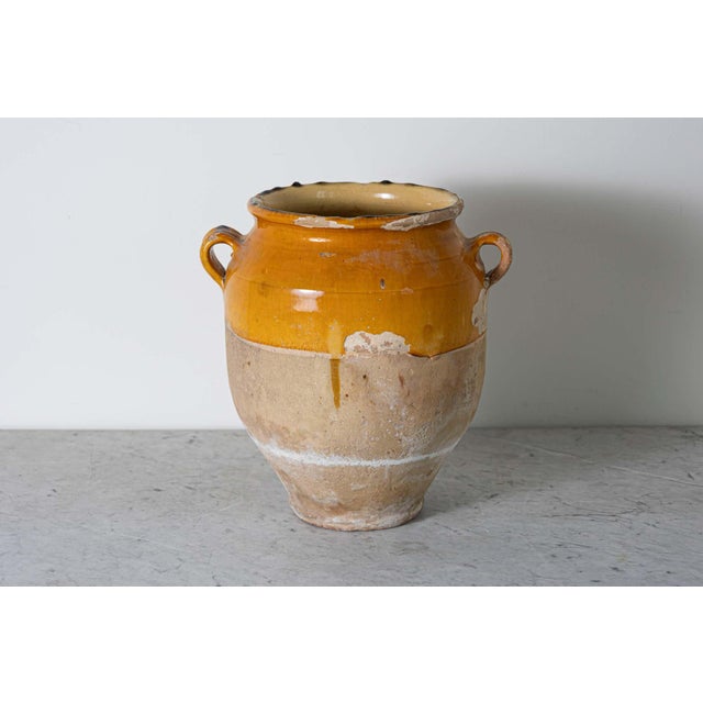 This 19th-century Spanish pottery jar is a beautiful example of rustic Mediterranean craftsmanship. Handcrafted from...