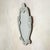 An Italian Art Deco Venetian wall mirror from the 1930s. Its silhouette is soft and ornate, framed in hand-cut, beveled...