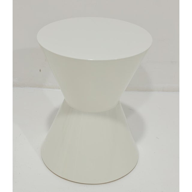 Minotti's Cesar's table in white shiny lacquer. Goes anywhere and perfect wherever you need a side table with style,...