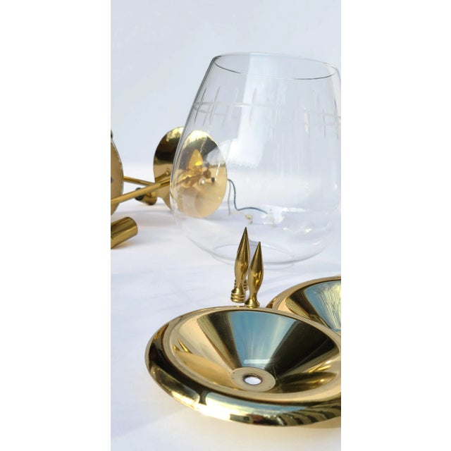 This set of three pendant lights feature large cognac snifter globes with a cut glass design of an infinity hash mark....