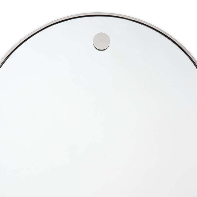 A contemporary mirror with simple details provides versatility for interior styles from modern farmhouse to minimalist.