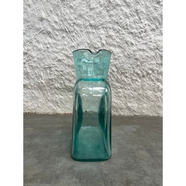 Double spout teal green blue glass carafe manufacturer by the Blenko Glass Company, USA. The carafe is not marked.