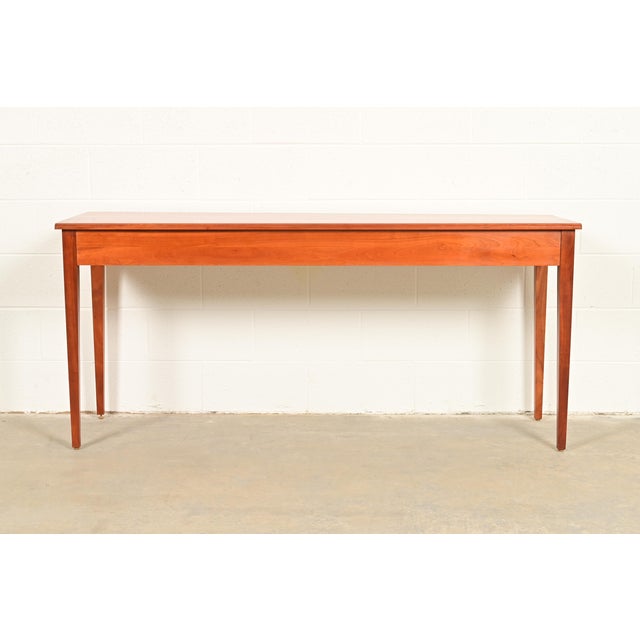 A beautiful Arts and Crafts or Shaker style solid cherry wood console table or sofa table By Harden Furniture USA, Circa...