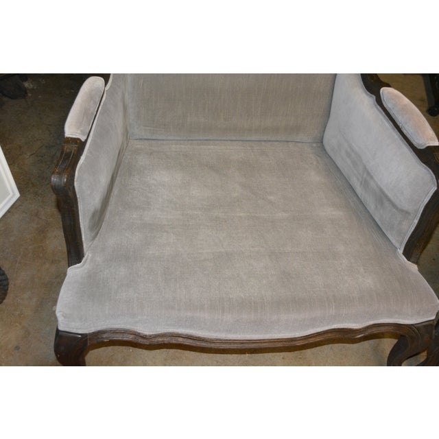 Great pair of RH wing back Lorraine arm chairs. Very comfortable in a plush silvery gray velvet. A rustic looking wood...