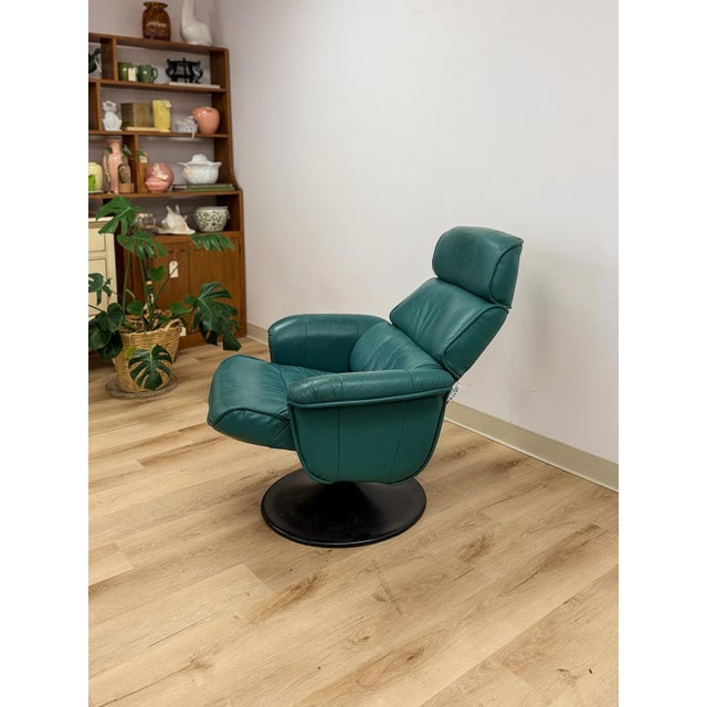 This comfortable and stylish vintage Chairworks teal adjustable recliner is a practical and good-looking living room find....