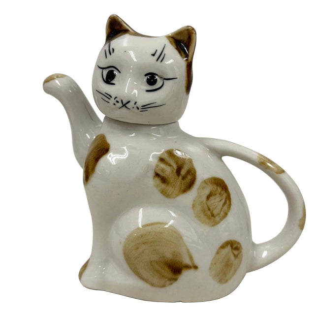 This Porcelain Cat teapot is well made in China in about 1930s, Chinese republic era. It purpose to make hot tea. This...