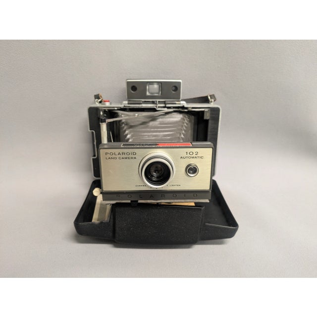 A vintage 1960s Polaroid Automatic Land Camera - #102. The Polaroid 102 Automatic was a special edition model and made...
