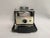 A vintage 1960s Polaroid Automatic Land Camera - #102. The Polaroid 102 Automatic was a special edition model and made...