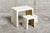The desk with stool is an Italian design from the 1970s, made of fiberglass with an off-white finish.