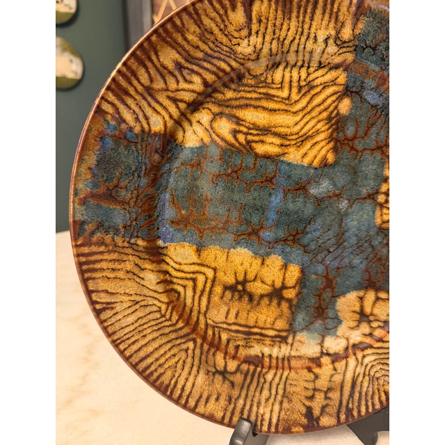 An exceptional mid-century modern studio art pottery charger plate by the celebrated French twins, Jean and Robert...