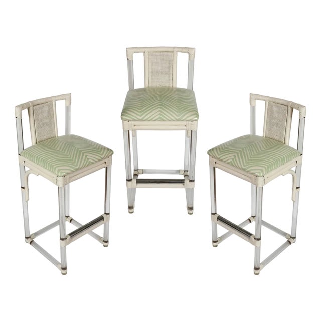 Set of Three Mid Century Lucite and Rattan Barstools With Quadrille Laminated Upholstery For Sale