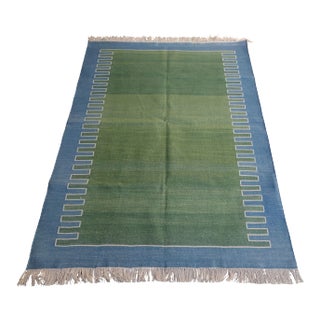 Handmade Green With Blue Geometric Border and Cream Fringe Rug - 10'x14' For Sale