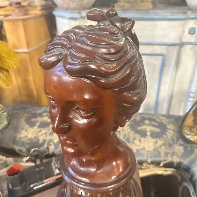 Capture the elegance of the early 20th century with this striking Sicilian Art Nouveau wood sculpture depicting the bust...