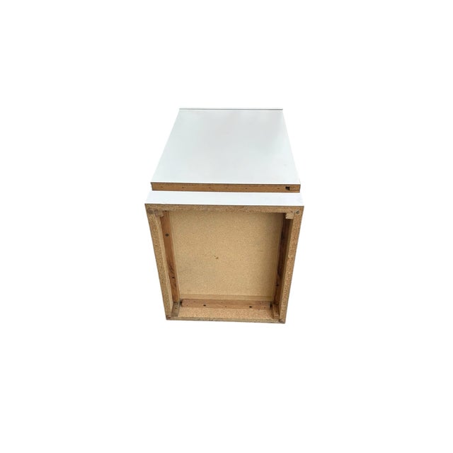 Pre- loved pair of white bedside tables. Campaign style with one drawer each and cubby space. They have brass hardware....