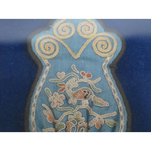 Qing Dynasty. mid 19th century, Chinese purse in frame. Elaborate bird and flower embroidery on silk with metal beading at...