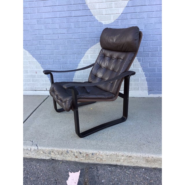 An exceptional and supremely comfortable lounge chair and ottoman designed by Bjarne Dahlqvist, this sculptural set...