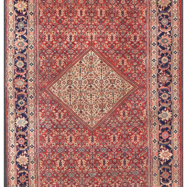 Measures: 8'9 x 19'11. Antique Persian Sultanabad rug with Sub-geometric motifs with a Diamond Central Medallion. Keivan...
