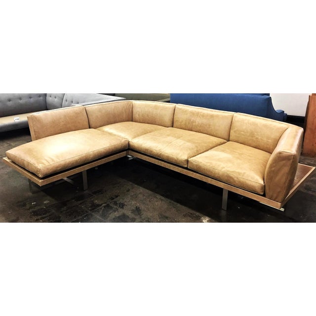 The Gio Sectional is a great design for any interior concept. Produced from a solid wood frame and finished in a walnut...