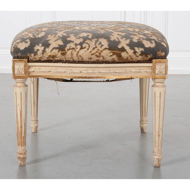Dimensions: 19”H x 24”W x 24”D A beautifully proportioned, 19th century Louis XVI-style French footstool. The pillowy...