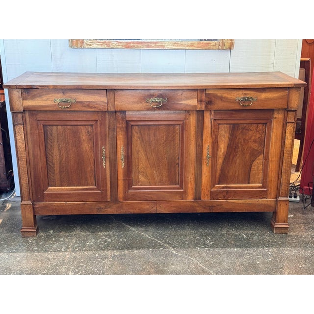 Early 20th century French walnut enfilade with good figure throughout, especially across the door panels. Three drawers...