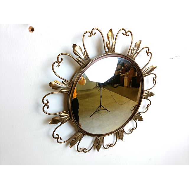 Mid century brass sunburst or flower mirror with convex glass. This mirror fits in most interiors and is a perfect add-on...