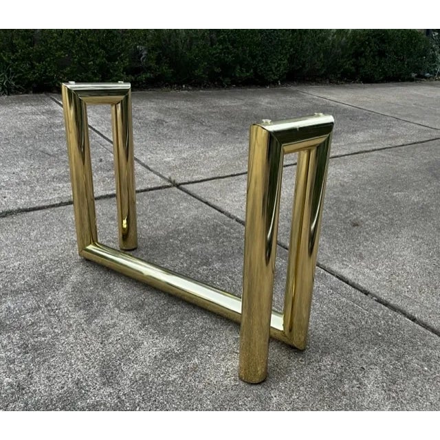 Elegant postmodern brass plated tubular “Z” console table with substantial beveled glass top. Is attributed to Karl...