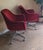 A nice pair of mid-century modern burgundy swivel tulip chairs. Featuring a corduroy like material minor wear to the arms...