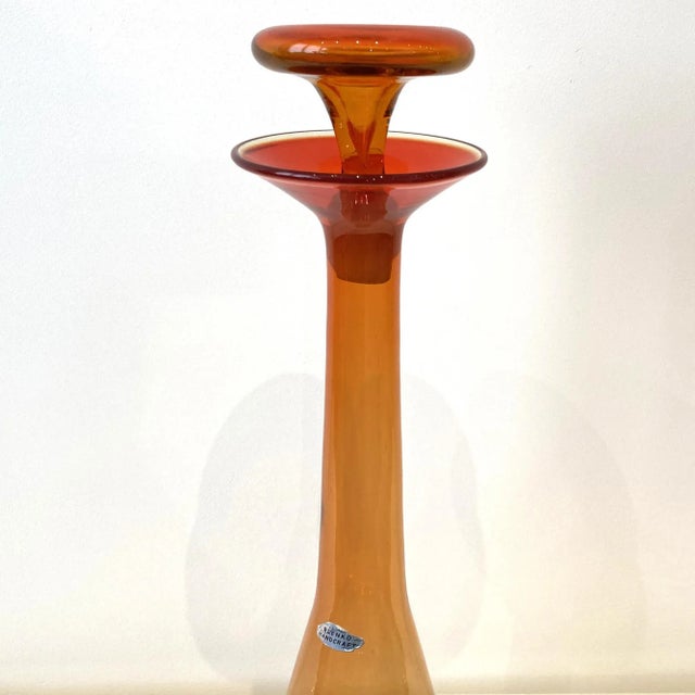 Many antique glass pieces have tiny tiny bubbles or other imperfections in the glass.