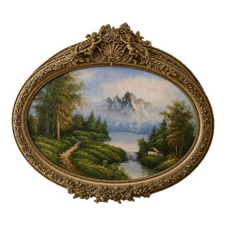 French-Style Oval Landscape Painting With Gold Leaf Frame & Cherub Details – Elegant Nature Wall Art For Sale