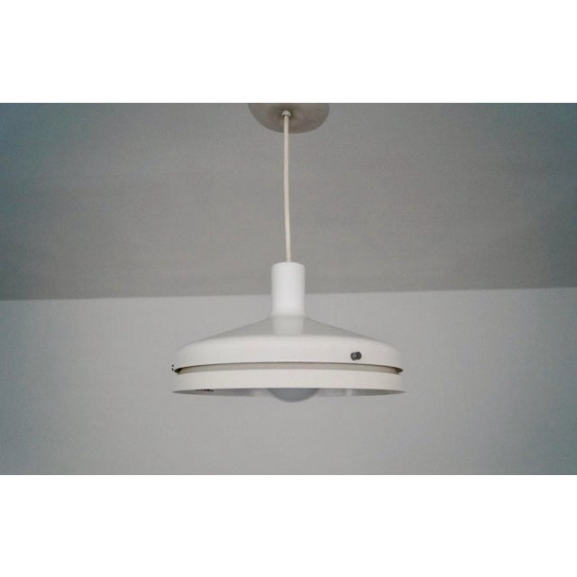 Vintage Mid-century Modern pendant for sale. From the 1950's, and in excellent condition. It's in great working order, and...