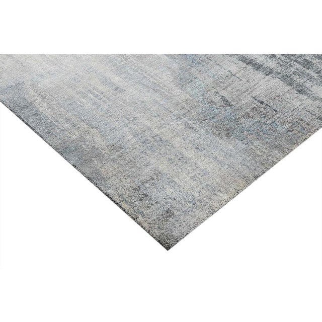 Beautiful hand knotted modern and fashionable collection of borderless designs rug, made of 75% wool and 25% cotton in...