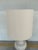 Stylish Arteriors Sutton Ivory Crackle Porcelain Lamp. Sculptural body with a linen cylinder shade. Original retail $687....
