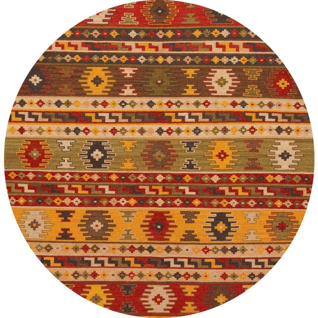 A beautiful hand-woven modern Kilim rug with a tan field and multi-color accents in an all-over geometric design. This rug...