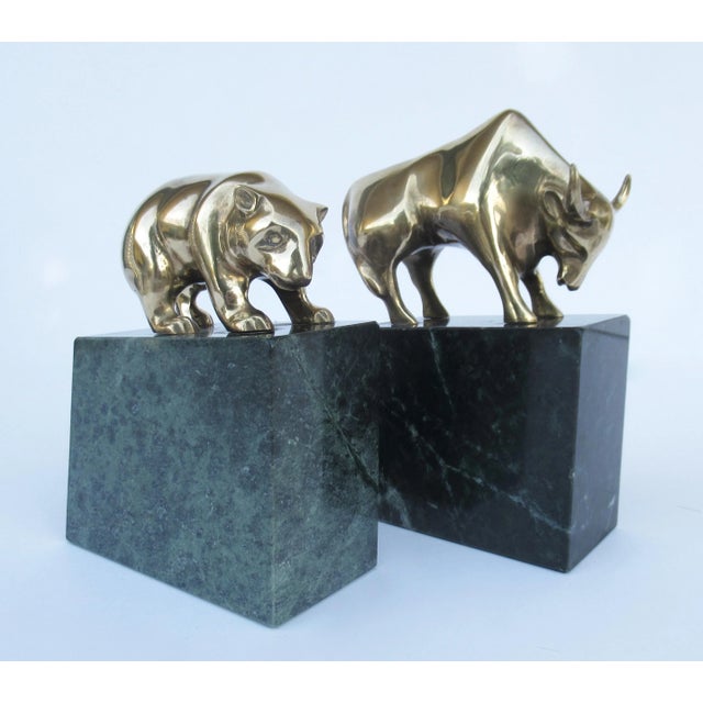 Vintage: C.1970's solid brass bear and bull stock exchange bookends mounted on green marble veined bases. Made in Taiwan....