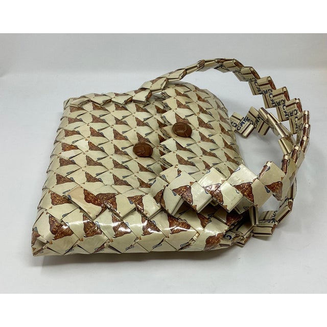 This is a classic example of eco-fashion or upcycling. Handcrafted using an origami-style folding technique. Made from...