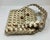 This is a classic example of eco-fashion or upcycling. Handcrafted using an origami-style folding technique. Made from...