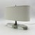 Elegant “Casper” desk or table lamp designed by Thomas O’Brien for Visual Comfort, featuring a sculptural combination of...