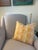 Alice Sergeant's Fabric in the pattern: Ottoman Quilt and color: Petal. Yellow and pink pillow cover printed on oyster...