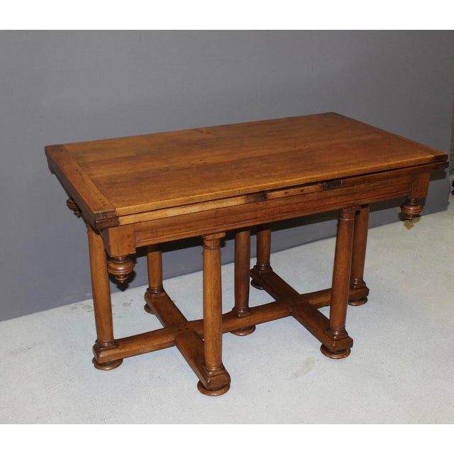 Late 17th or early 18th century Renaissance walnut table with Italian-style extensions, a seven-column base (known as a...