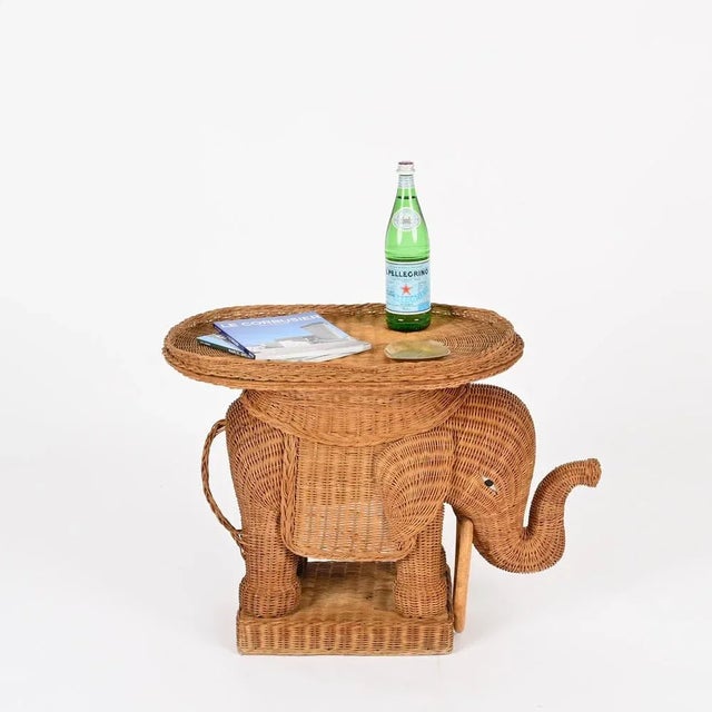 Wonderful midcentury elephant-shaped side table with removable tray fully made in hand-woven wicker. This stunning organic...
