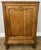 This elegant Vintage French cabinet showcases beautifully carved detailing, a warm oak finish, and classic period styling...